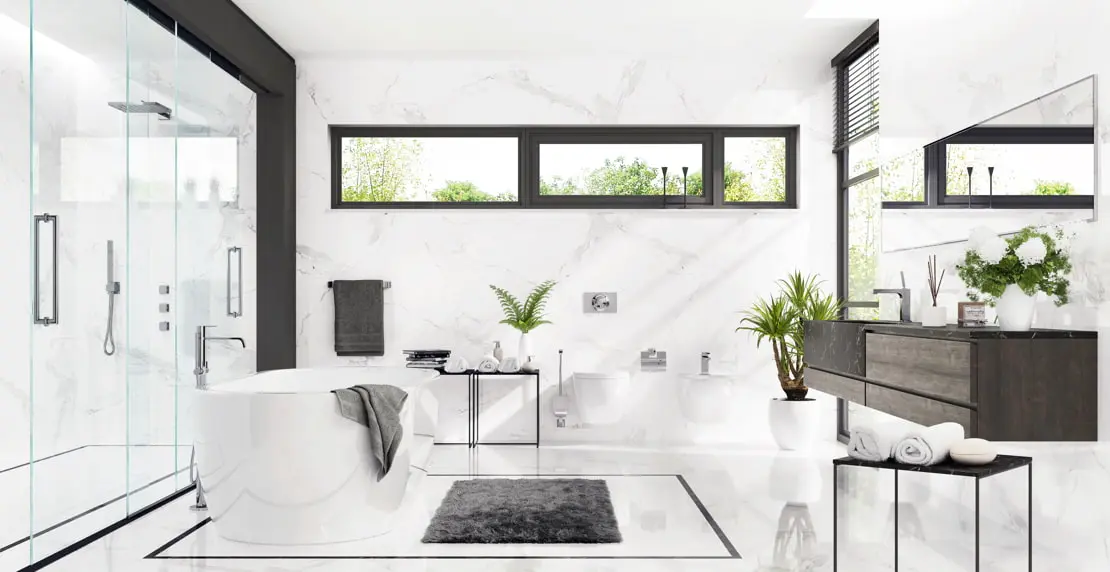 Luxury bathroom with a bathtub and a shower, which has transparent screens