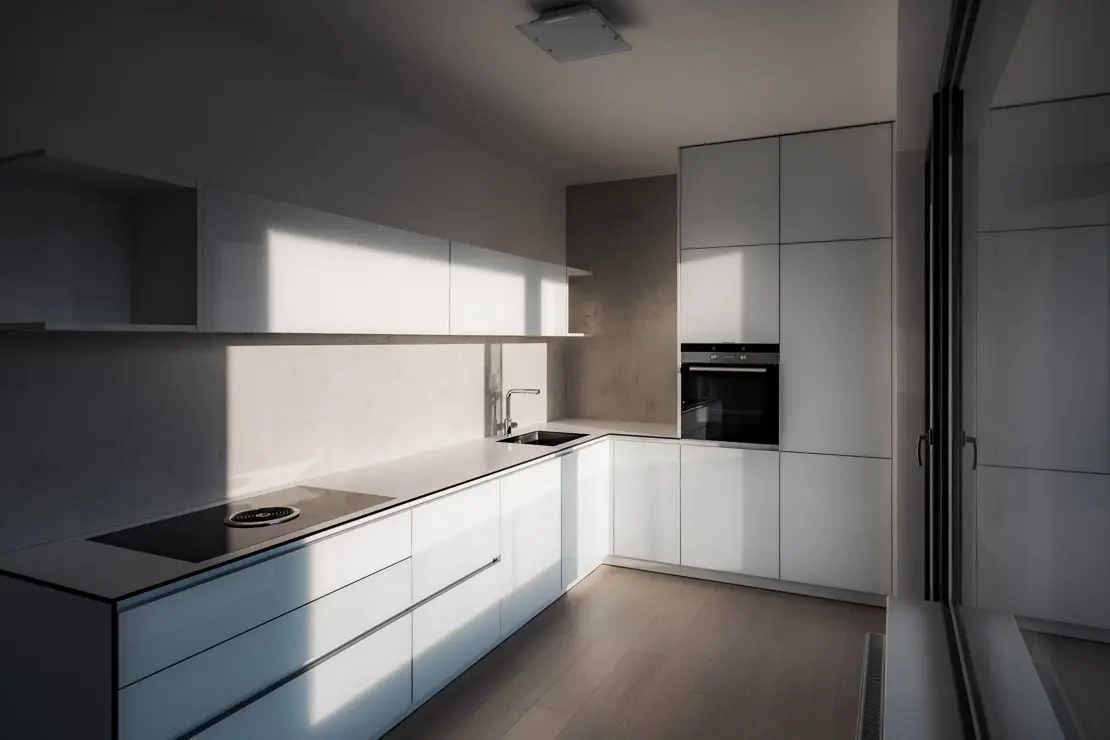 Kitchen with microcement on the wall and natural light entry through a large window