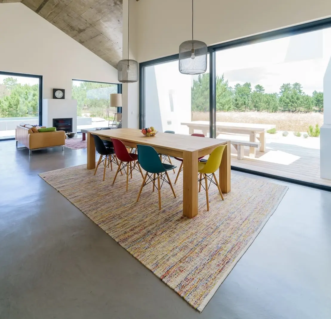 Rough texture microcement on interior dining room floor