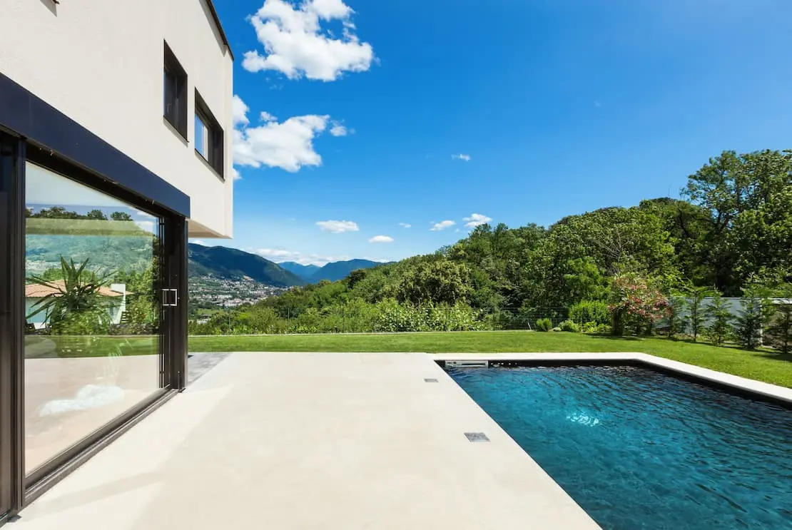 Garden with facade and decorative concrete pool