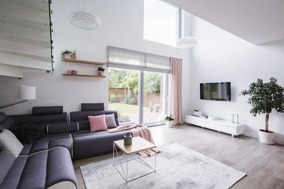 Modern luxury living room decorated with white tones and wooden floor