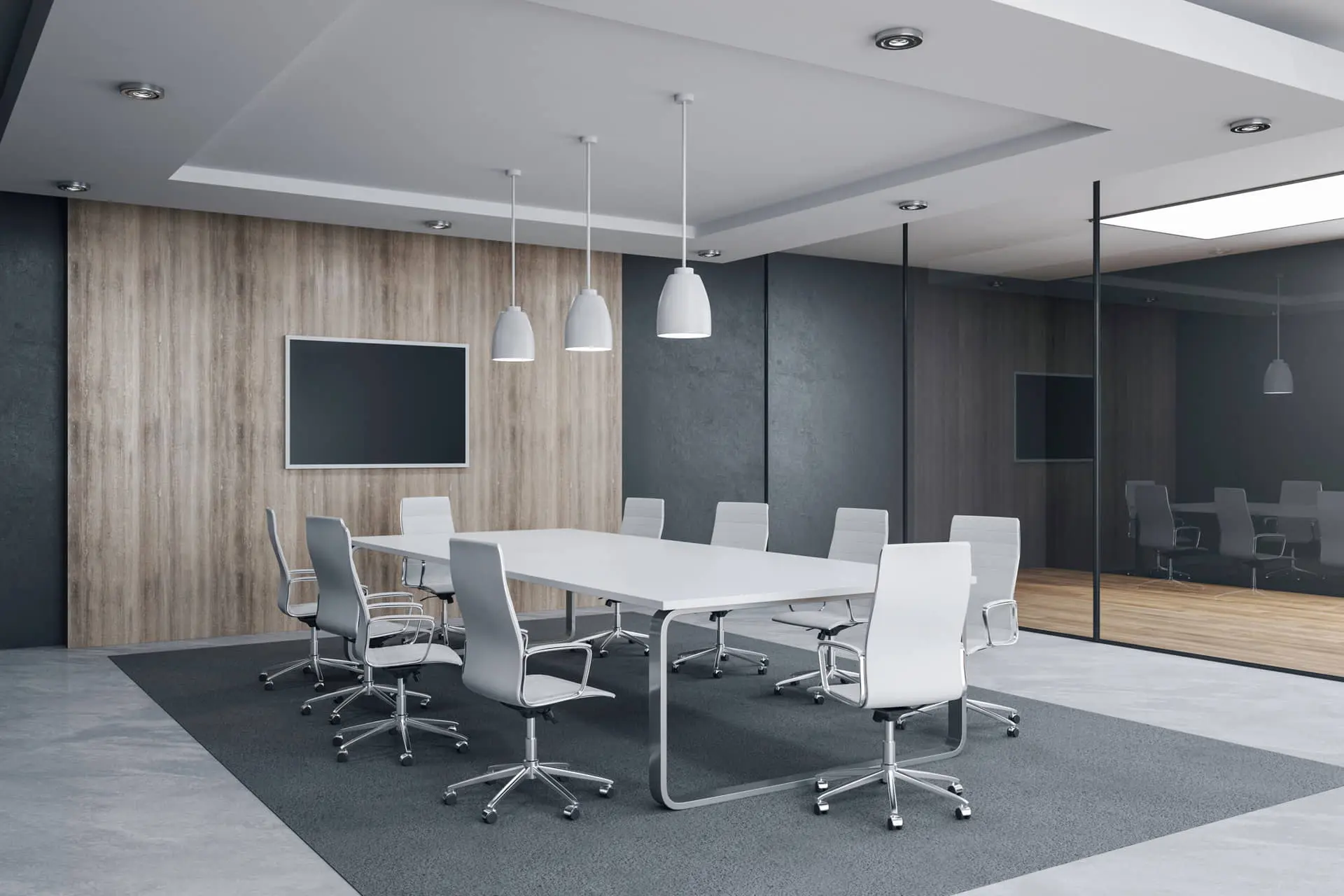 माइक्रोसीमेंट के ग्रे रंग के फर्श के साथ मीटिंग रूम